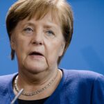 Germany’s Merkel laments influence of big business on Trump