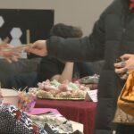 Young entrepreneurs make sales at kids’ business fair