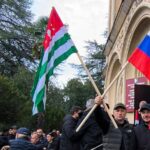 Protesters in separatist Georgian region occupy government buildings, calling for leader’s ouster