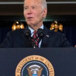 Biden signs defense bill, despite ban on transgender health care for military kids