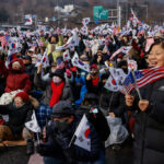 Rival government forces face off outside South Korea’s presidential compound