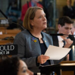 State Sen. Jane Raybould sings in opposition to Nebraska legislative committee assignments