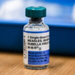 What causes breakthrough measles infections?